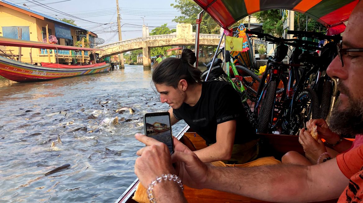 Feed cat fish on the boat