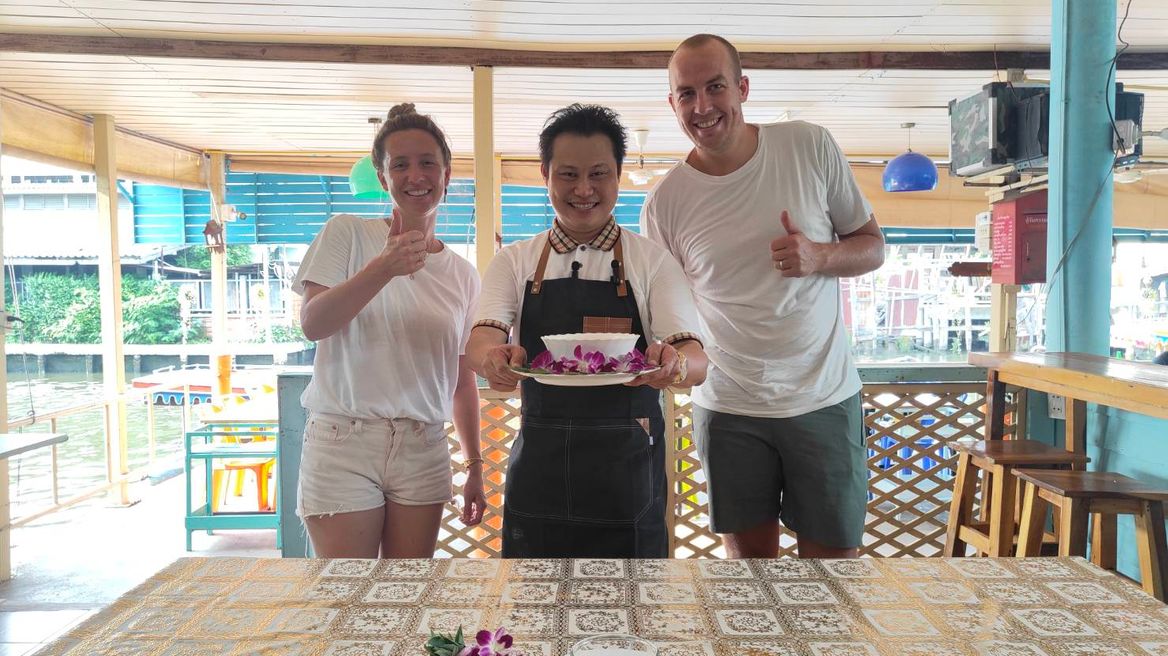 Tourists are happy in learning to make Thai food.
