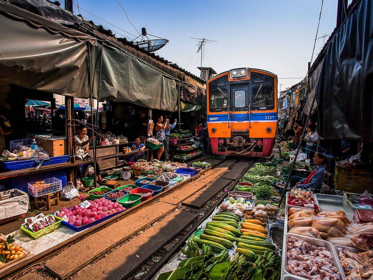 Maeklong Railway Market (umbrella market) - the train is approaching!