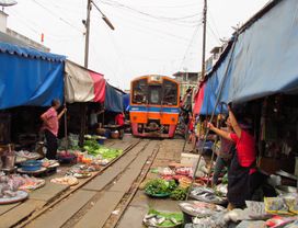 Let's Ride a Train to Explore Delicious Food in Maeklong Railway Market