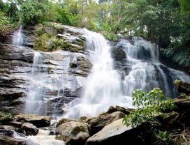 Visit Tat Mok Waterfalls and Interact with Buddhist Monks