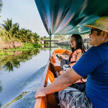 Boat Along Local Canal & Visit Farmers' Community