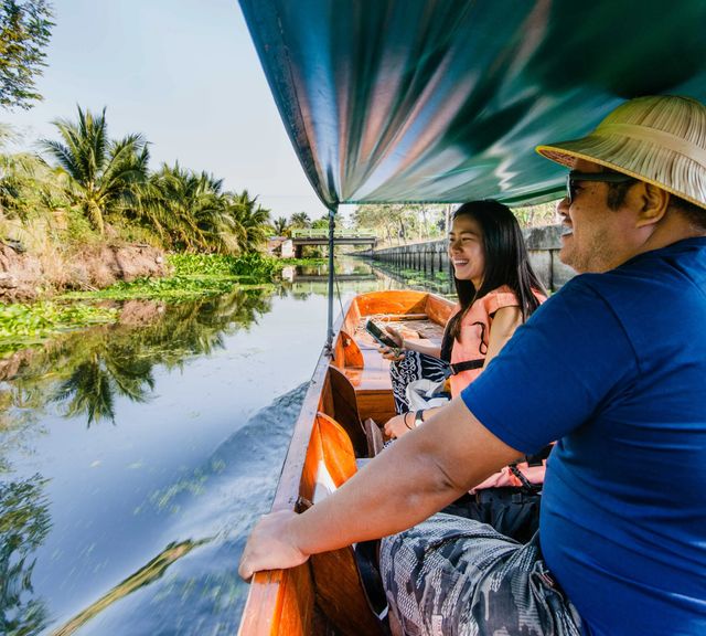 Boat Along Local Canal & Visit Farmers' Community
